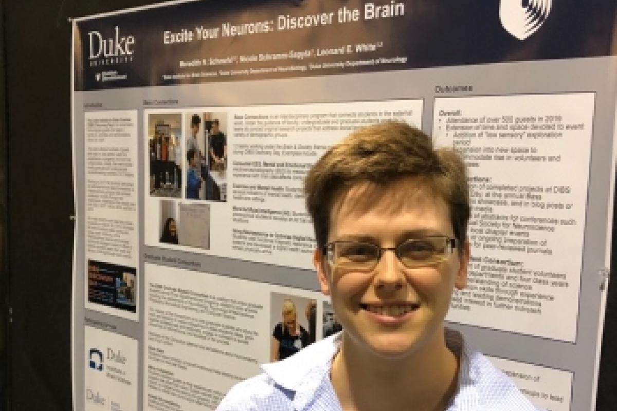 Duke Neurobiology PhD student Meredith Schmel with her DIBS Discovery Day poster at Neuroscience 2019