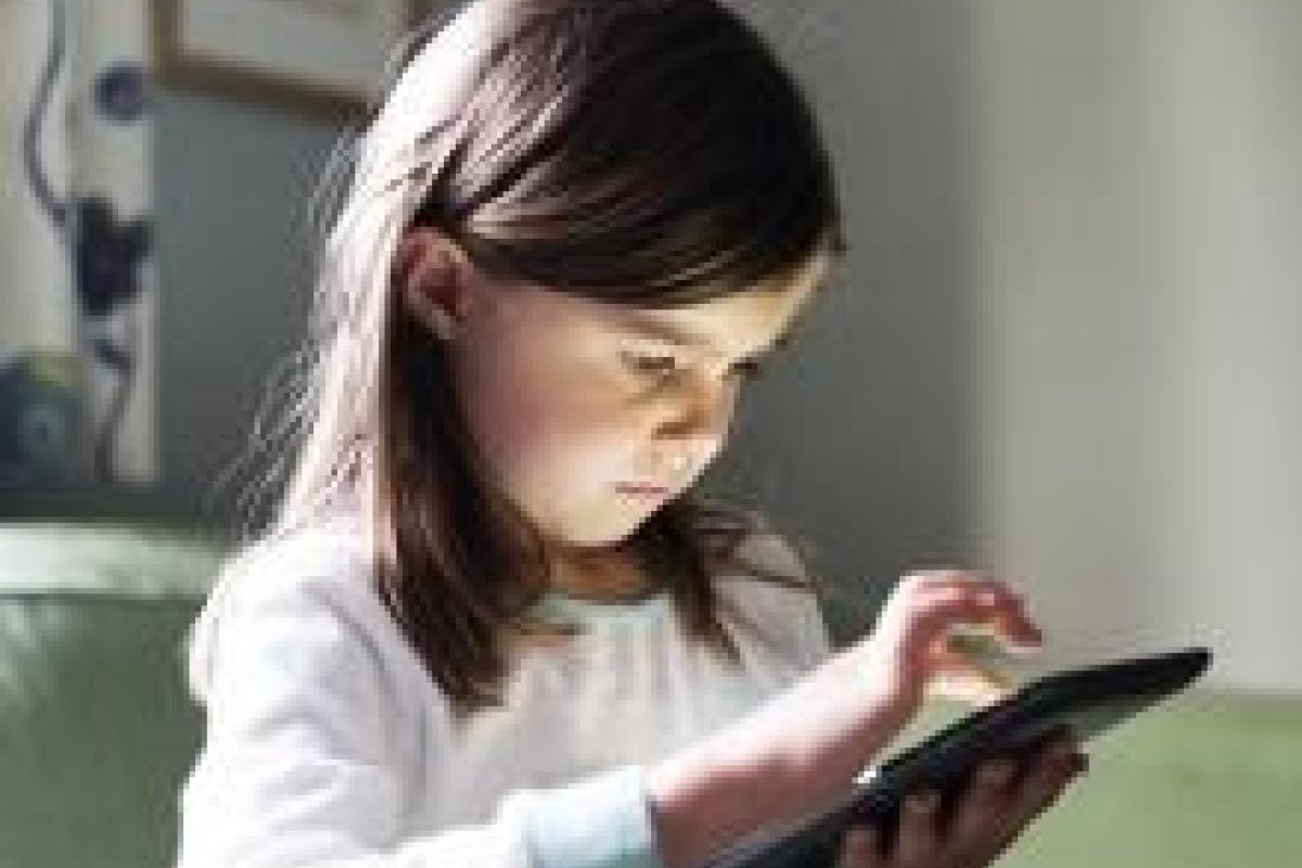A girl on a tablet.