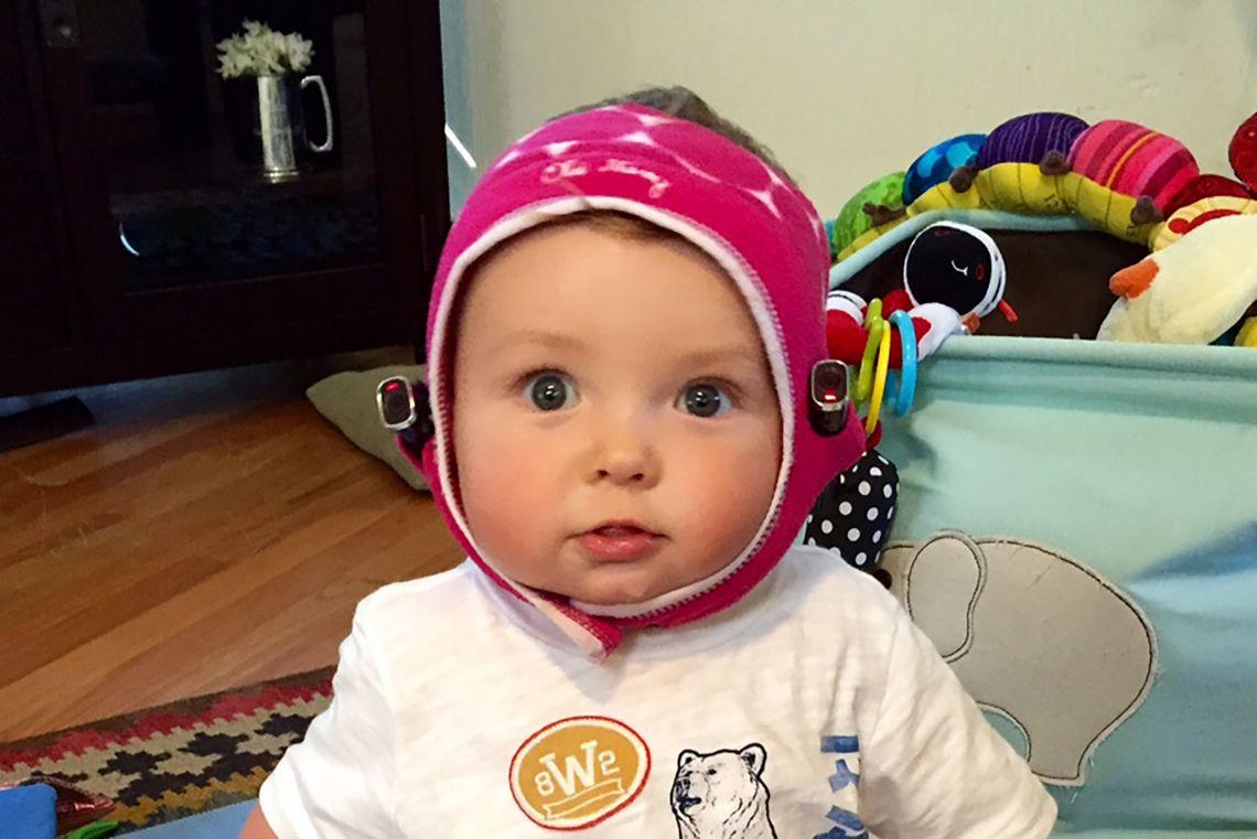Baby wearing dual-camera headset.